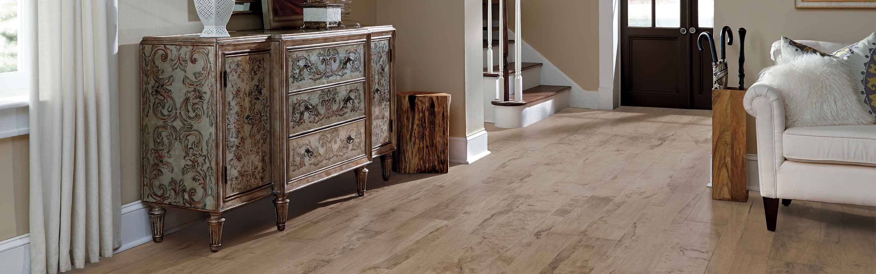 Natural hardwood flooring in entryway living area