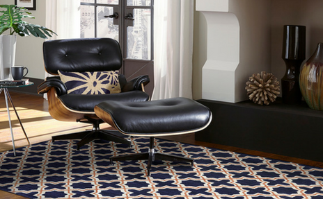 Black patterned area rug and black leather chair